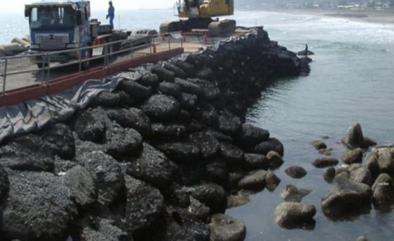 Rock bags forming a breakwater in front of a quay